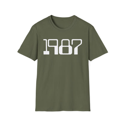 Olive green t-shirt with white "1987" text graphic.