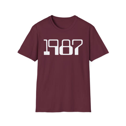 Maroon t-shirt with the year 1987 printed in white block letters.